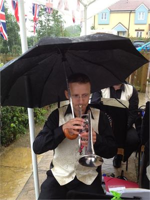 Matt on Solo Cornet avoiding the rain